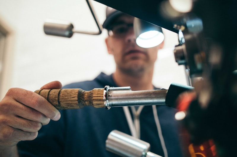 Technician working on a mechanical unit with hand tools